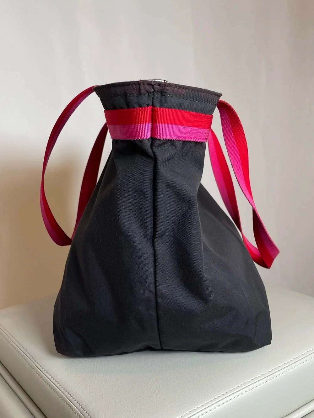 kate spade black tote with pink and red trim